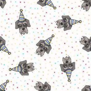  Hand drawn cute schnauzer breed dog with party hat seamless pattern.