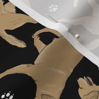 Trotting yellow Labrador Retrievers and paw prints - black