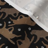 Tiny Trotting chocolate Labrador Retrievers and paw prints - black