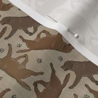 Tiny Trotting chocolate Labrador Retrievers and paw prints - faux linen