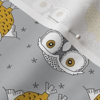 sideways gold owls on grey