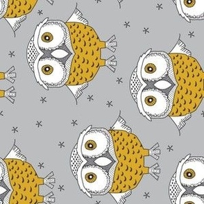 sideways gold owls on grey