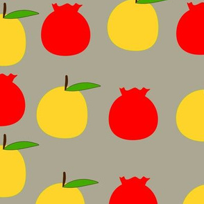 Red and yellow fruits on the grey background