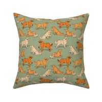 Small scale // Origami Golden Retriever and Labrador friends // sage green linen texture background orange and beige paper and cardboard dogs