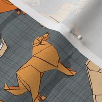 Small scale // Origami Golden Retriever and Labrador friends // green grey linen texture background orange and beige paper and cardboard dogs