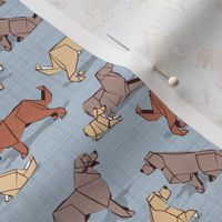 Tiny scale // Origami Golden Retriever and Labrador friends // pastel blue linen texture background brown and beige paper and cardboard dogs