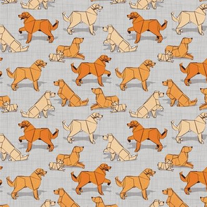 Tiny scale // Origami Golden Retriever and Labrador friends // grey linen texture background orange and beige paper and cardboard dogs