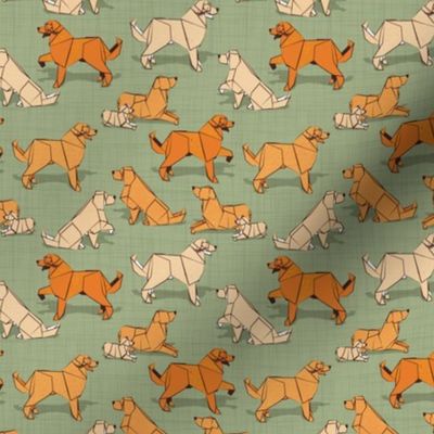 Tiny scale // Origami Golden Retriever and Labrador friends // sage green linen texture background orange and beige paper and cardboard dogs