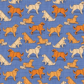 Tiny scale // Origami Golden Retriever and Labrador friends // denim blue linen texture background orange and beige paper and cardboard dogs