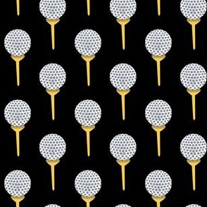 golf ball on tee gray yellow and white on black