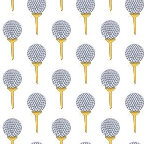 golf ball on tee gray yellow and white