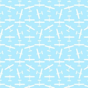 Scattered Vintage Airplane Silhouettes in White with a Baby Blue Background (Mini Scale)
