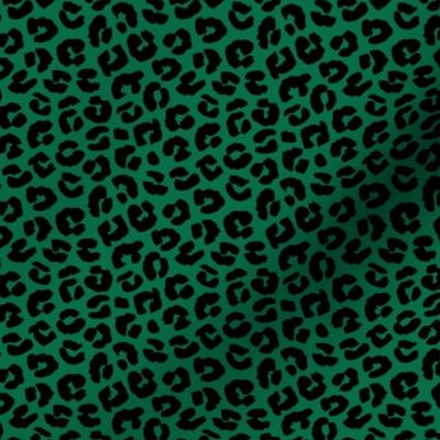 Little St Patrick's Day leopard design messy animal print boho nursery trend black on green 