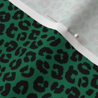 Little St Patrick's Day leopard design messy animal print boho nursery trend black on green 