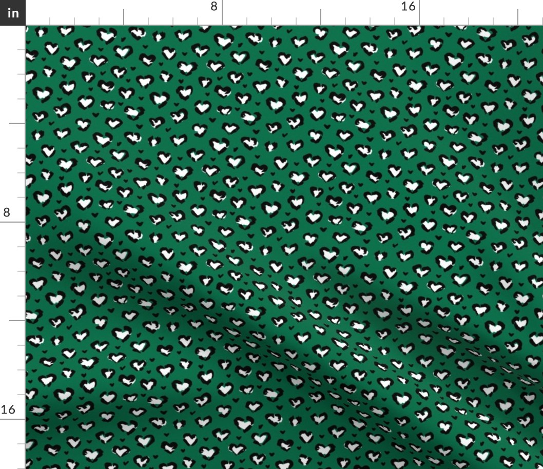 Little St Patrick's Day hearts leopard design messy animal print boho nursery trend white black on green SMALL