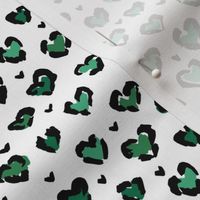 Little St Patrick's Day hearts leopard design messy animal print boho nursery trend green on white 