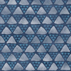 Block Print Pyramid Triangles on Faded Denim (large scale) | Hand block printed triangle pattern in turquoise and white on blue gray denim.