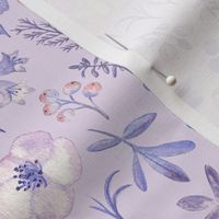 Lilac flowers and herbs on light violet