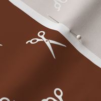  Barbershop Scissor Icons in White with a Walnut Brown Background (Regular Scale)