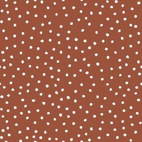 white dots on rust red