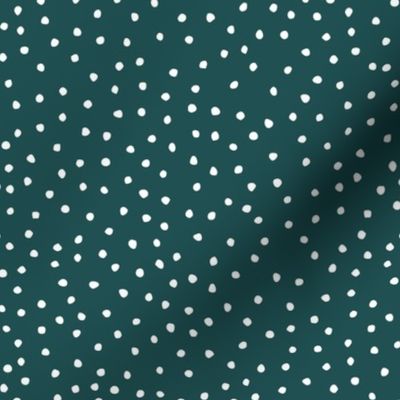 white dots on emerald background