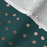 Rose gold dots on emerald green