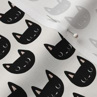 small scale // little black cat faces 