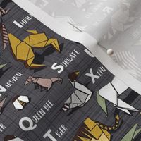 Small scale // Origami ABC animals // charcoal grey linen texture background yellow grey green and brown paper geometric animals