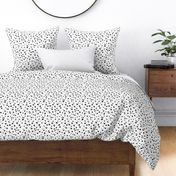 The messy animal print Dalmatian dots and leopard panther spots wild life boho trend nursery monochrome black and white