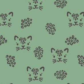 Cute leopards. Jade background