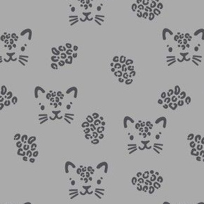 Cute leopards. Gray background