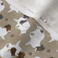 Tiny Trotting Papillons and paw prints - faux linen