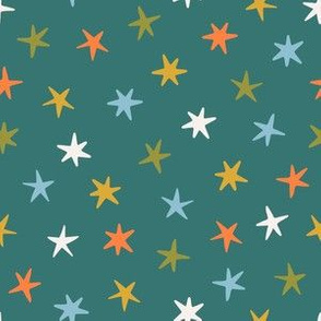 Colored stars on the emerald background