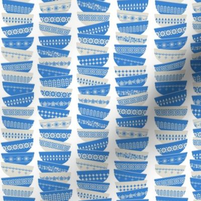 stacked bright blue garland pyrex bowls - white background - ditsy