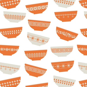 scattered orange pyrex bowls