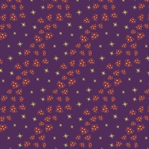 Yellow stars, brick red asteroids on purple background