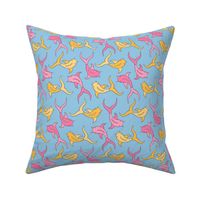 Pink and yellow koi fish swimming on blue background