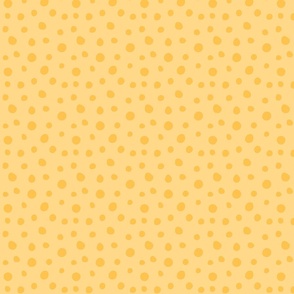 Gold dots on a yellow background