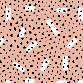 Wild Cheetah confetti dots and strokes boho nursery design black and white coral apricot blush