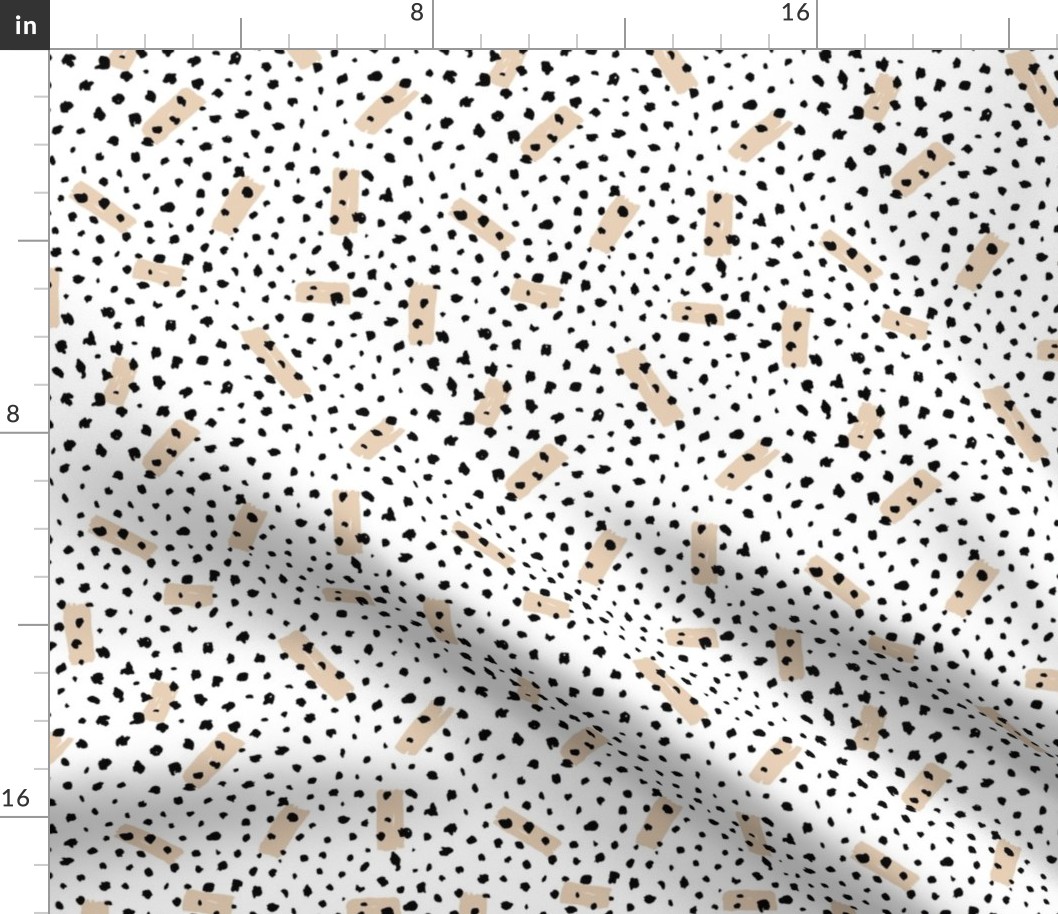 Wild Cheetah confetti dots and strokes boho nursery design black and white beige latte