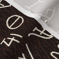 Cream Brands on dark leather