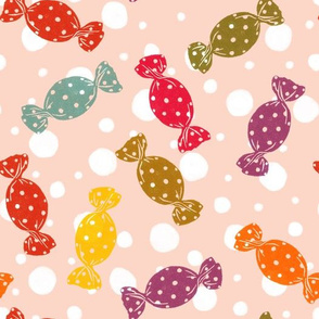 Candy on flesh colored background with polka dots medium