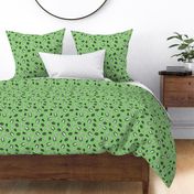 Cute owls and trees tossed on a bright green background