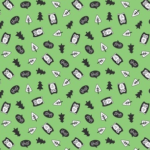 Cute owls and trees tossed on a bright green background