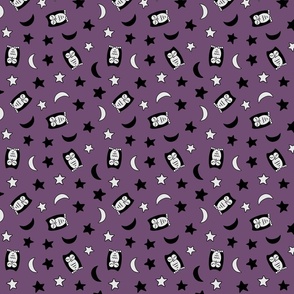 Cute owls, stars, and moons tossed on a purple background