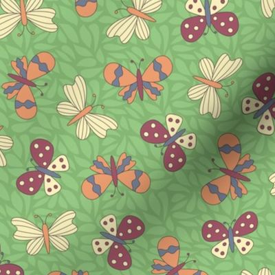 Cranberry red, orange, slate blue, and yellow butterflies, leafy green background