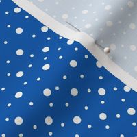 White polka dots on blue