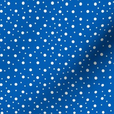 White polka dots on blue