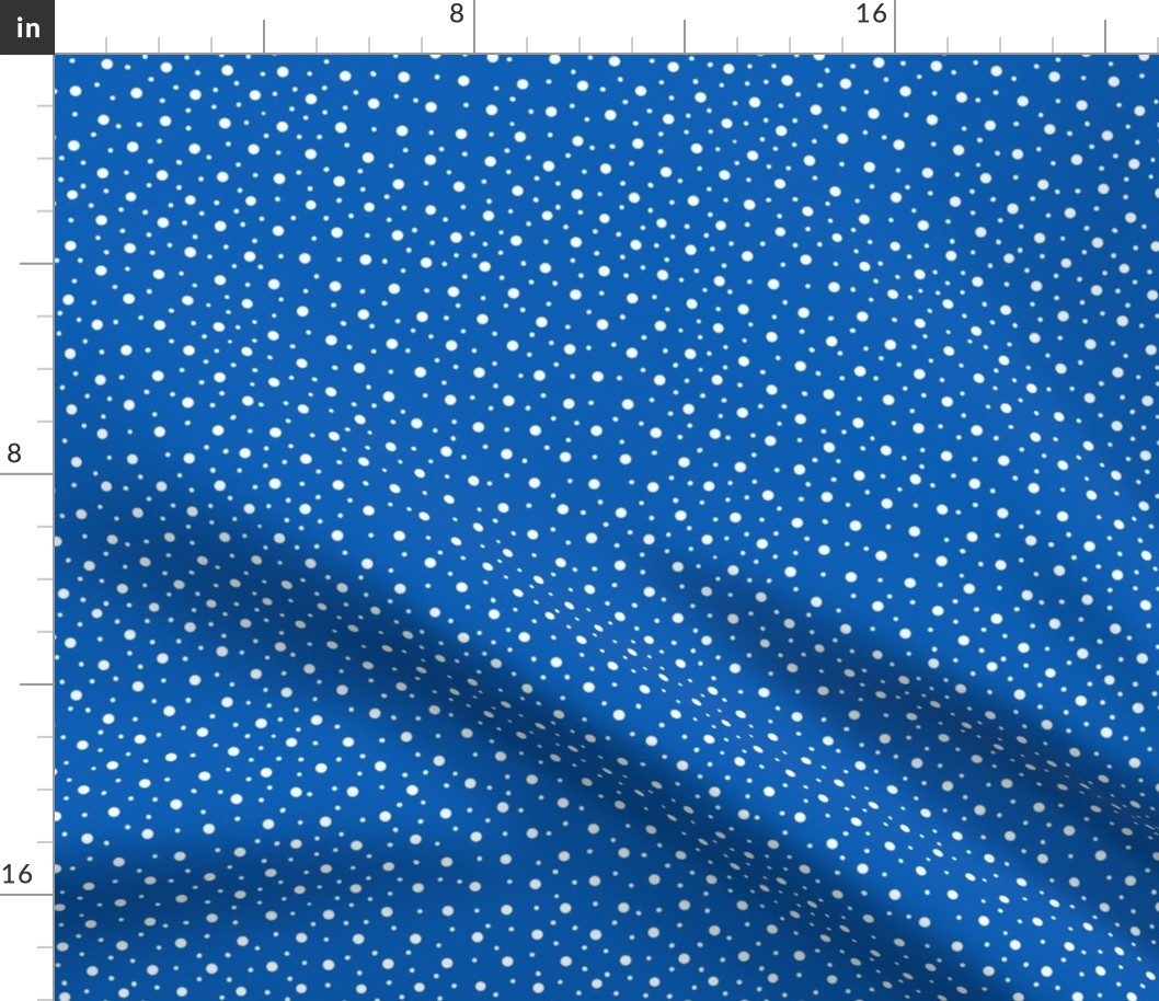 White polka dots on blue