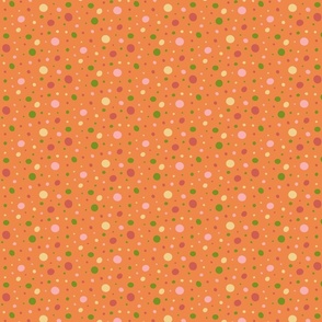 Pink, red, green, and yellow dots on an orange background